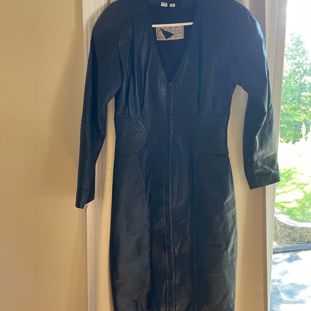 Black leather dress w zipper up front.  Looks great on.